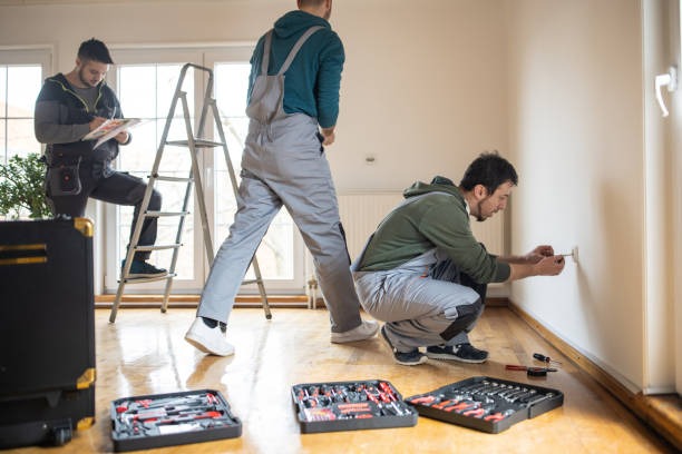 dedicated-repairman-team-doing-their-work-in-clients-house
