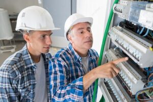 electrician-showing-the-inside-of-electrical-panel-board